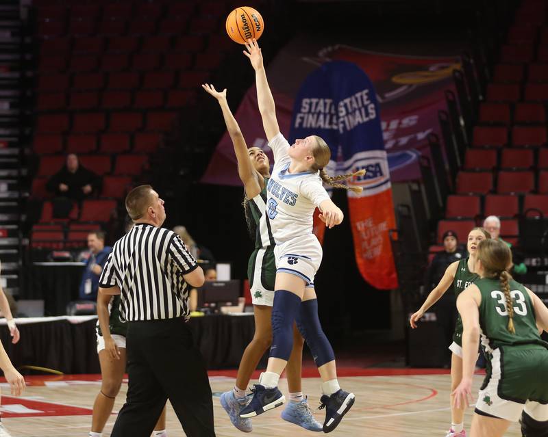 Cissna Park's Addison Lucht wins the opening tip off over St. Edward's Savannah Lynch during the Class 1A third place game on Friday, March 7, 2025 at CEFCU Arena in Normal.