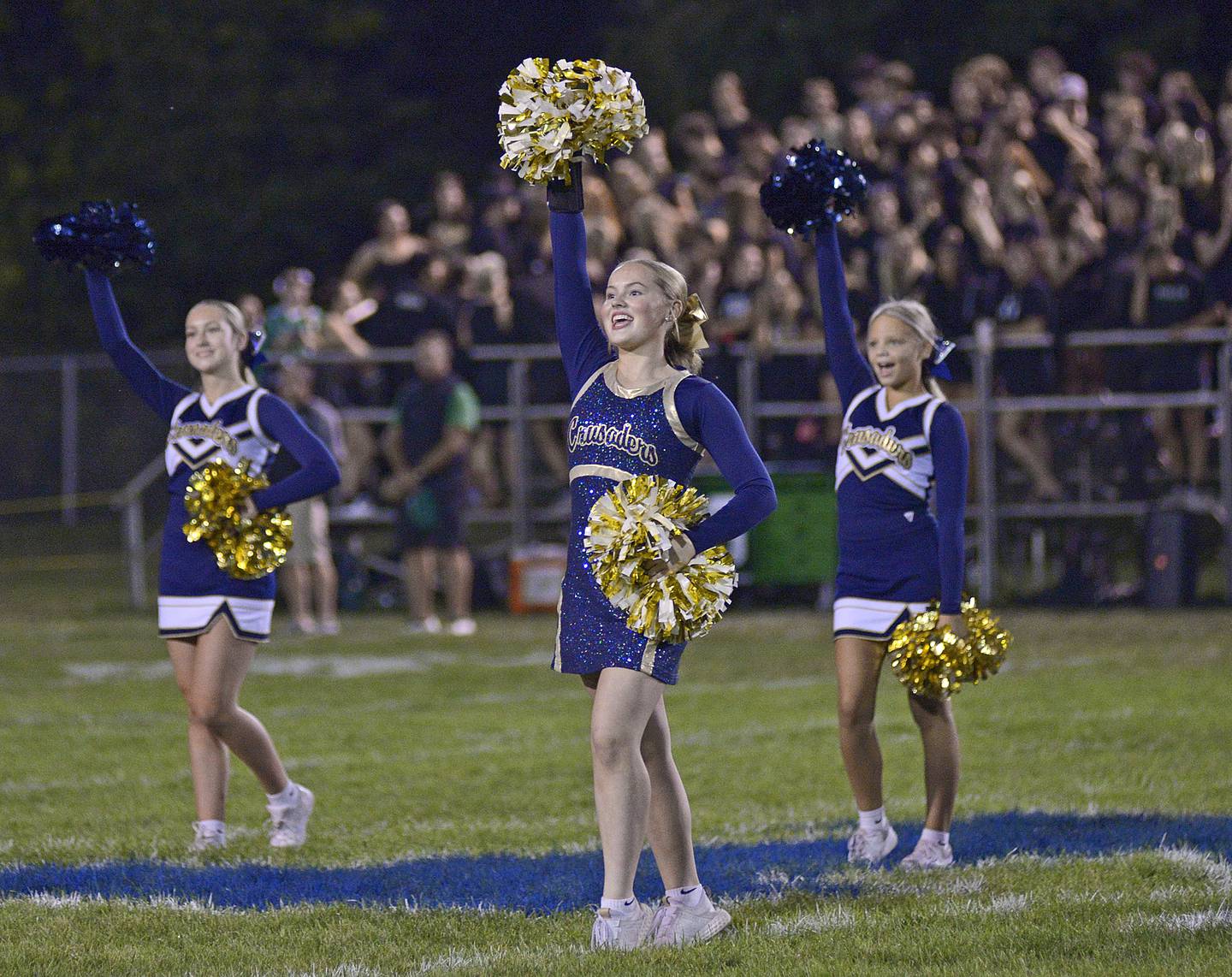 Marquette Crusader cheerleaders rev the crowd up prior to the start of Friday nights game against Seneca.