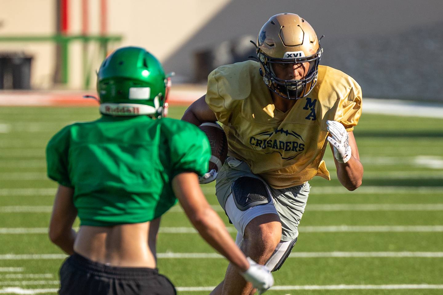 Blayden Cassel of Marquette runs football during scrimmage on Tuesday July 16, 2025 at Howard Fellows Stadium in LaSalle.