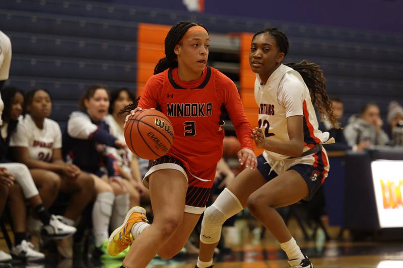 Minooka’s Kennedi Brass drives along the baseline against Romeoville on Tuesday January 24th, 2023.