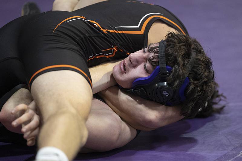 Dixon’s Channing Sarver is pinned by Freeport’s Thomas Olson Tuesday, Jan. 13, 2025, during a triangular meet with Sterling at Dixon High School.