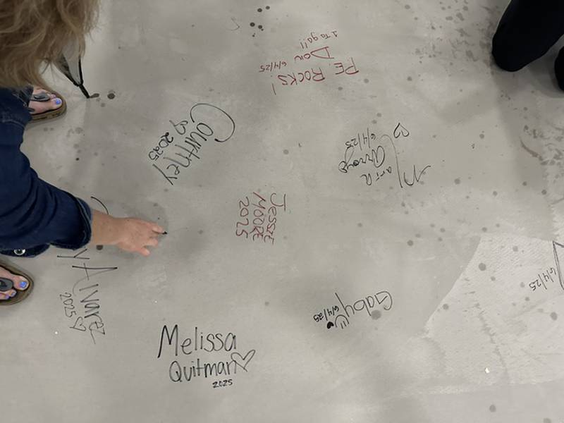 Gompers teachers and staff signed their names to the concrete floor of the school's new gymnasium, which is set to open in August 2025. 
Wednesday, June 4, 2025.