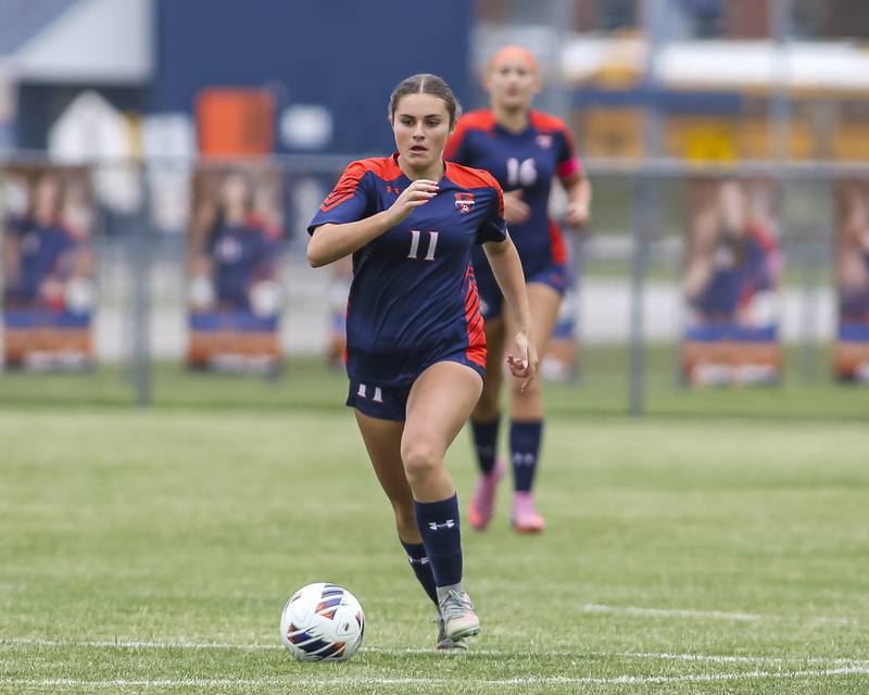 Oswego's Mane Brolley (11) races down the pitch during Class 3A regional final soccer match between Neuqua Valley at Oswego on Saturday, May 23, 2026 in Oswego.