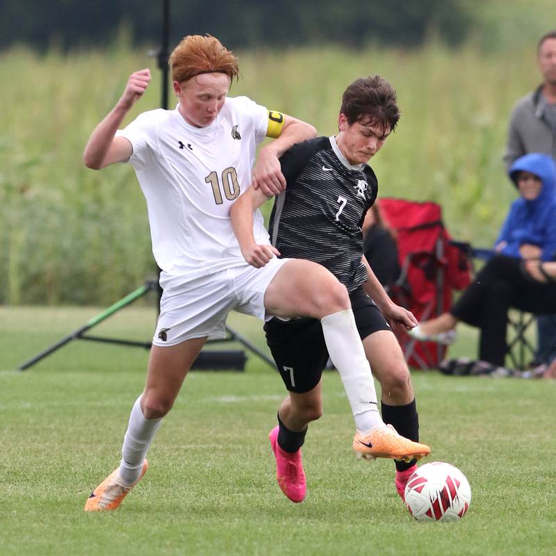 Sycamore's Jameson Carl (left) and Kaneland's Cameron Guernon try to win possession during their game Wednesday, Sept. 6, 2023, at Kaneland High School in Maple Park.