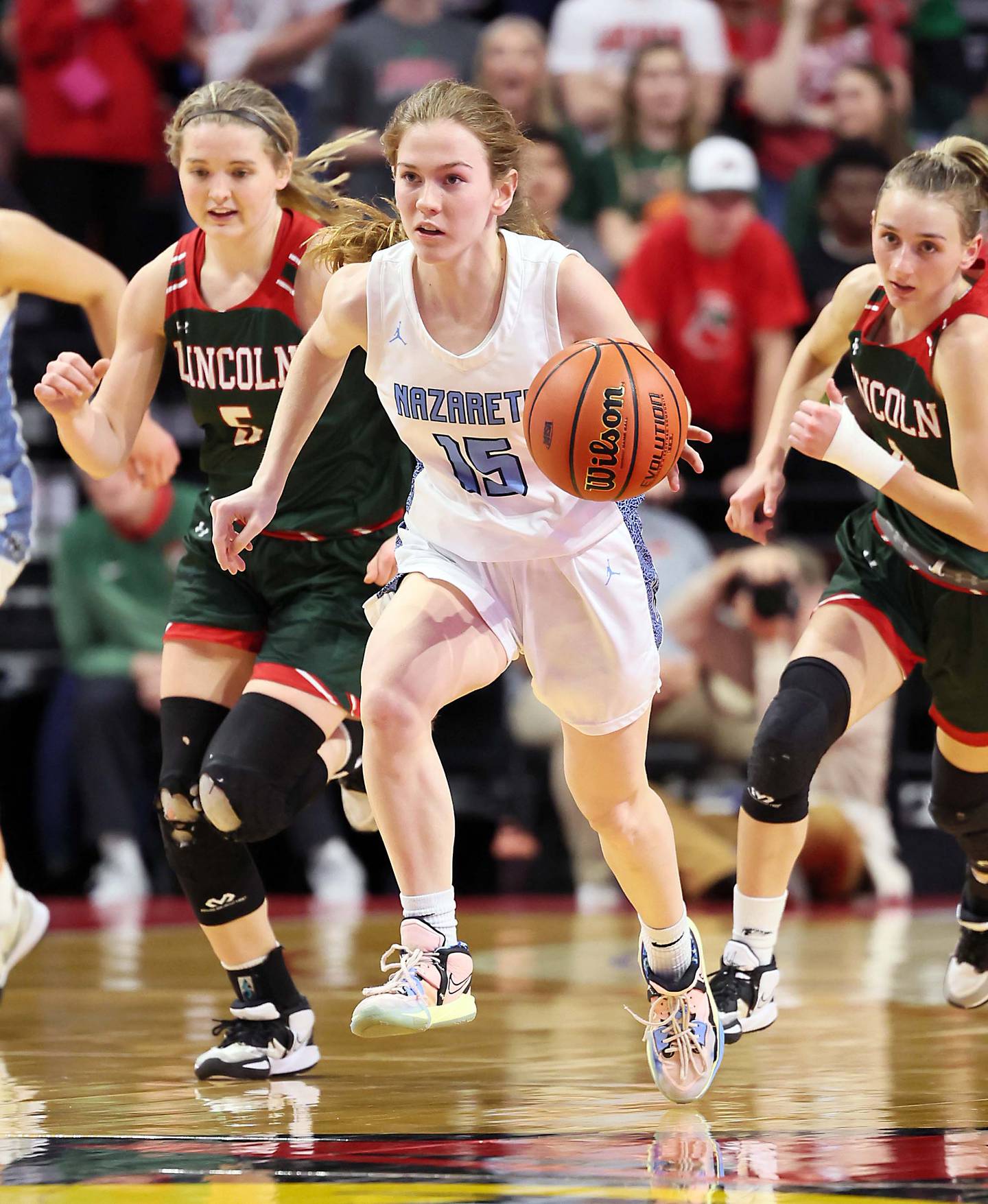 Nazareth Academy's Mary Bridget Wilson (15) brings the ball up court during the IHSA Class 3A girls basketball championship game at the CEFCU Arena on the campus of Illinois State University Saturday March 4, 2023 in Normal.