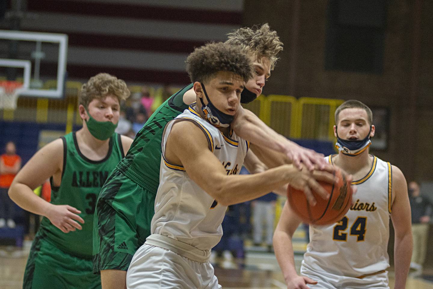 Sterling's Andrew Klaver and Alleman's Noah Brinkman fight for a rebound in Sterling on Friday, Jan. 21, 2022.