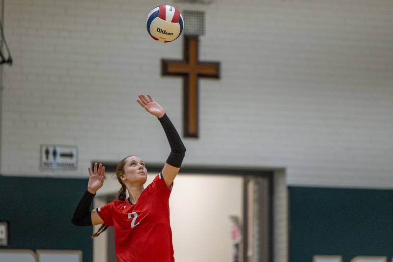 Addy Ewing (2) of Woodland serves ball on Thursday, Sept. 11, 2025 at Abbot Vincent Gymnasium in Peru.