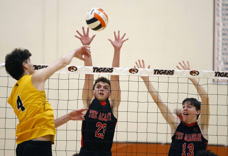 Metea Valley’s Ryan Da Silva (4) tries to spike the ball past Benet Academy’s Luke Mitr (23) and Owen Sweeney (13) during the Wheaton Warrenville South Tiger Classic boys volleyball tournament Saturday, April 19, 2025 in Wheaton Ill.