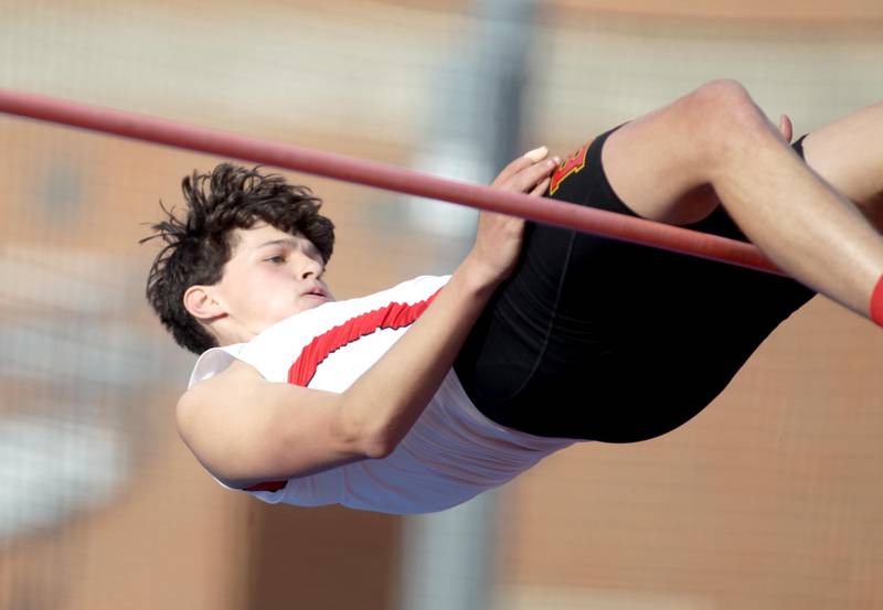 Batavia’s Alec Crum competes in the high jump during the Kane County Championships track and field meet at St. Charles North on Friday, May 5, 2023.