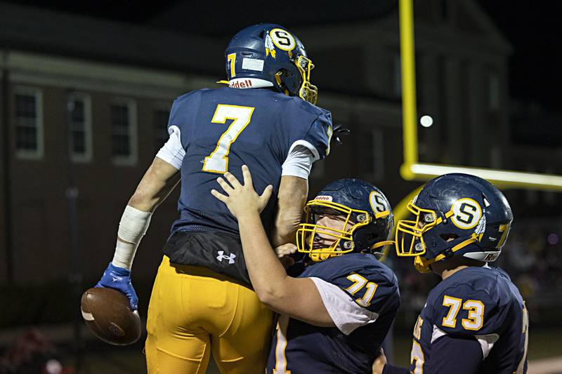 Sterling’s Andre Klaver celebrates a touchdown against Quincy Friday, Oct.6, 2023 in Sterling.