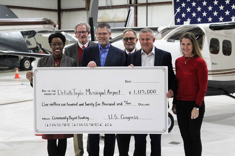 U.S. Rep. Lauren Underwood, D-Naperville, visited the DeKalb Taylor Municipal Airport Jan. 20, 2023 to celebrate $1.1 million in federal funding she helped secured for the first phase of a perimeter fence security upgrade. She was joined by (from left to right) DeKalb City Manager Bill Nicklas, 7th Ward Alderman Tony Faivre, DeKalb County Economic Development Corporation Executive Director Paul Borek, Mayor Cohen Barnes and Airport Manager Renee Riani.