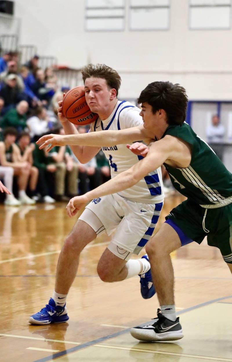 St. Bede's John Brady defends Princeton's Korte Lawson Friday night at Prouty Gym.