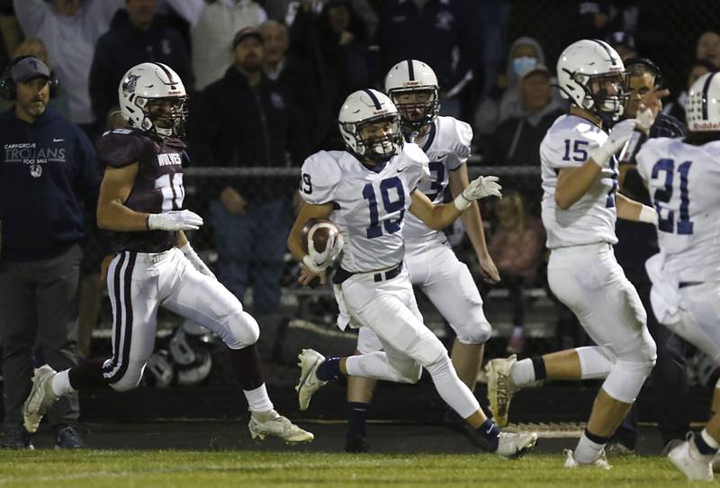 Cary-Grove's Andrew Prio tries to cut back as he is chased by Prairie Ridge's Jeffrey North  during a Fox Valley Conference football game between Prairie Ridge  and Cary-Grove Friday, Sept. 23, 2022, at Prairie Ridge High School in Crystal Lake.