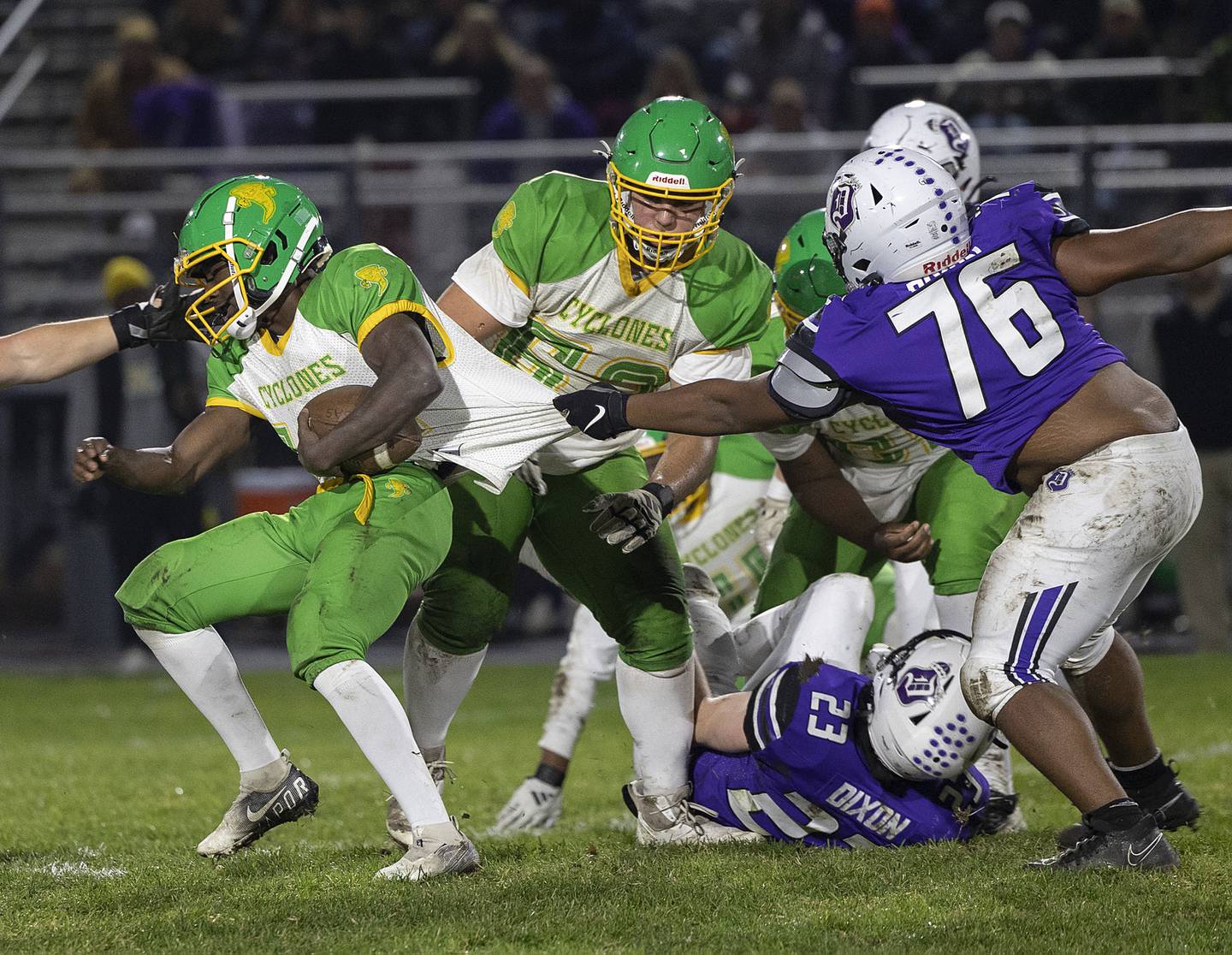 Chicago Ag Science’s Maurice Bush is grabbed by Dixon’s Jayden Neal Friday, Nov. 8, 2024 in the second round of the Class 4A football playoffs.