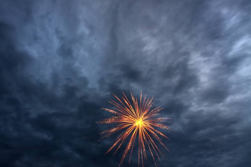 Fireworks color the sky Saturday, July 2, 2022, during the Red, White and Blue Food Truck FEASTival at Milky Way Park in Harvard.