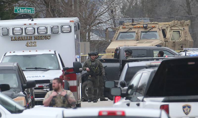 Police secure the scene of a two-story apartment building on the corner of Seventh and Charters on Sunday, March 30, 2025 in La Salle. A barricaded armed subject fired shots at officers. Police from across the Illinois Valley assisted in the incident.