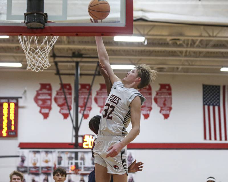 Yorkville's Joey Jakstys (32) puts up a shot off of a baseline drive during their basketball game between Oswego at Yorkville Friday, Dec 12, 2025 in Yorkville.