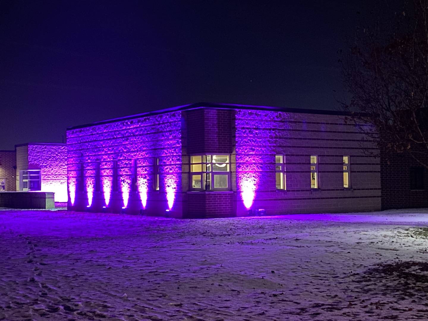 Purple lights gleam outside Sycamore Middle School, 150 Maplewood Drive, in honor of Sycamore sixth grader Maggie Green, 11, who died Wednesday, Nov. 29, 2023, from cancer. Purple lights have been displayed across town for weeks to support Maggie and her family. Purple was Maggie's favorite color.