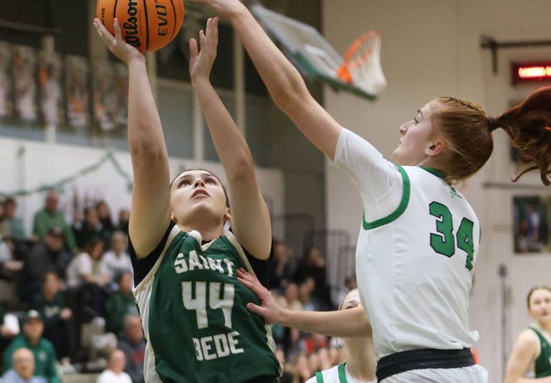 St. Bede's Hanna Waszkowiak lets go of a shot over Alleman's Alaina Schulz during the Class 2A Regional finals on Thursday, Feb. 19, 2026 at St. Bede Academy.
