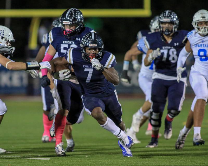 IC Catholic Prep's Denzell Gibson (7) takes off with the ball during varsity football game between St Francis at IC Catholic Prep.