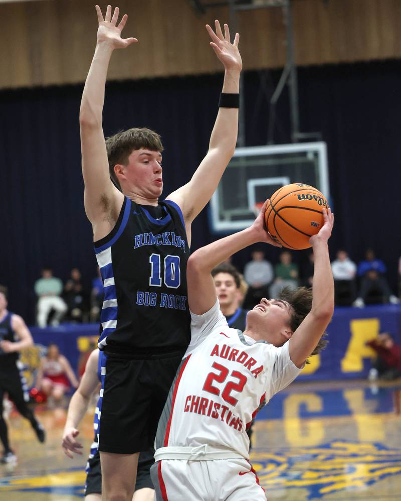 Aurora Christian's Jacob Baumann tries to shoot over Hinckley-Big Rock's Max Hintzsche during their sectional final game Friday, March 7, 2025, at Somonauk High School.