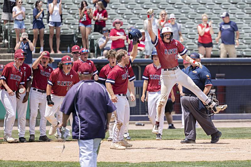 Gibrault’s Hudson Blank leaps on home plate after hitting a home run against Henry-Senachwine Saturday, June 3, 2023 during the IHSA class 1A championship baseball game.