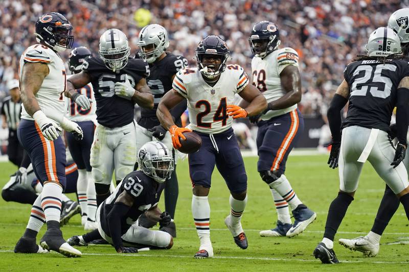 Chicago Bears running back Khalil Herbert reacts after running for a gain against the Las Vegas Raiders during the first half Sunday in Las Vegas.