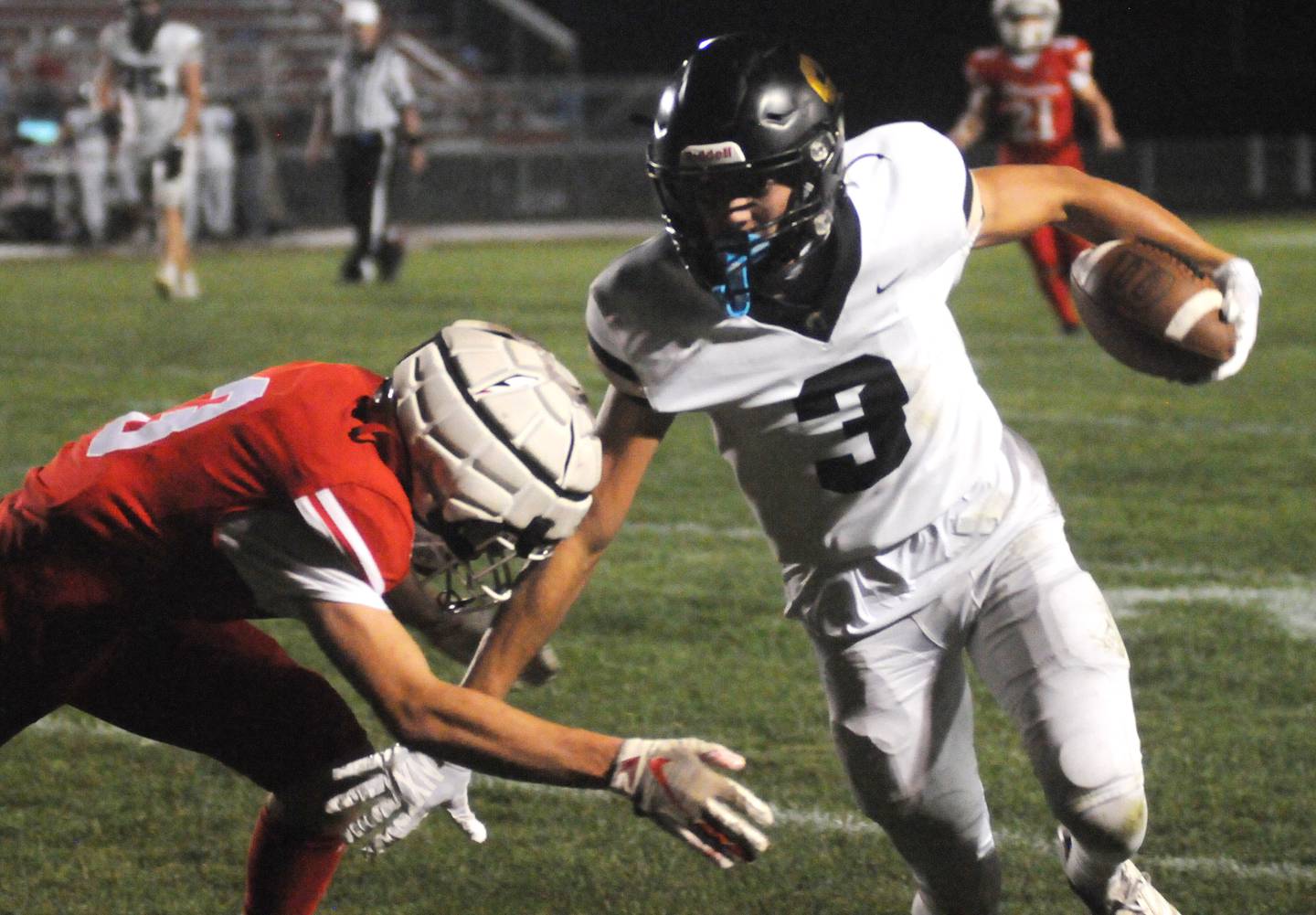 Sycamore's Ben Anderson (3) evades Ottawa's George Shumway on Friday, Sept. 26, 2025 at King Field.
