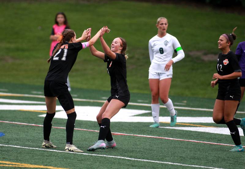 Wheaton Warrenville South's Ashlyn Adams and Wheaton Warrenville South's Kelsey Clousing celebrate Clousing’s goal during a Class 3A Glenbard West Sectional semifinal game against Glenbard West on Tuesday, May 27, 2025 in Glen Ellyn.