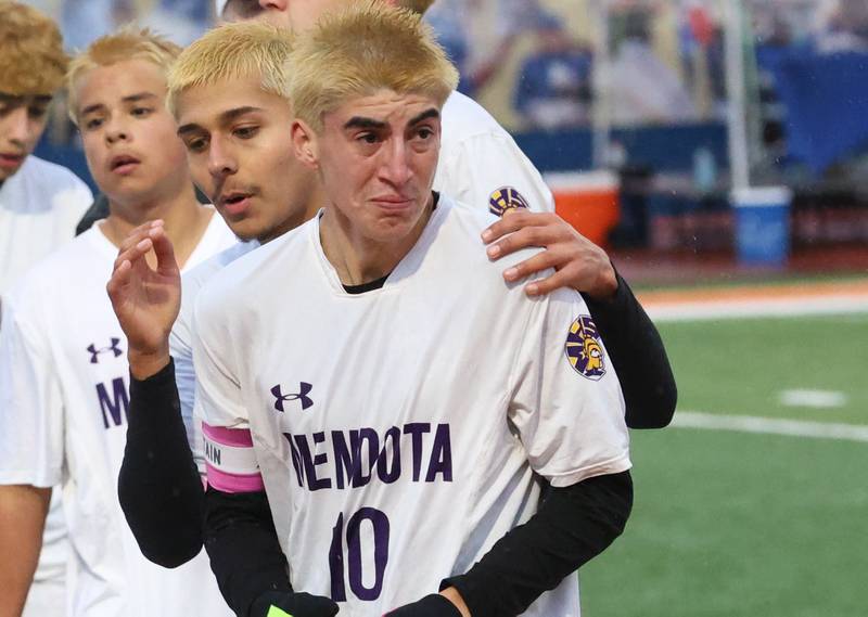 Mendota's Johan Cortez reacts as teammate Sebastian Carlos comforts him during the Class 1A State title game on Saturday, Nov. 8, 2025 at Hoffman Estates High School.