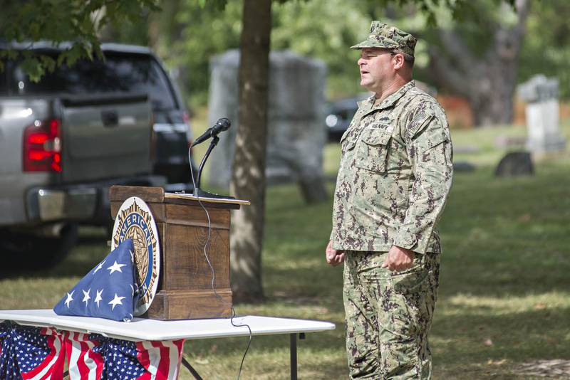 Dennis Van Zuidan, senior vice commander of the Morrison American Legion, sings the national anthem Sunday, Sep. 26, 2021 at the start of a flag retirement ceremony.