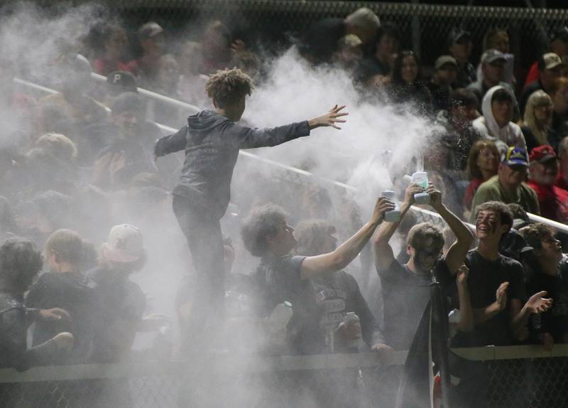 Hall superfans throw baby powder in the air to celebrate a touchdown while playing Illinois Valley Central on Friday, Sept. 29, 2023 at Richard Nesti Stadium.
