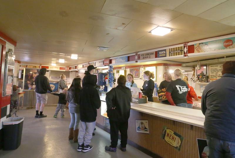 Movie gowers wait in line at the concession stand at the Route 34 Drive-In Theater on Friday, April 19, 2024 in Earlville. The Drive-In theater opened for the season this weekend.