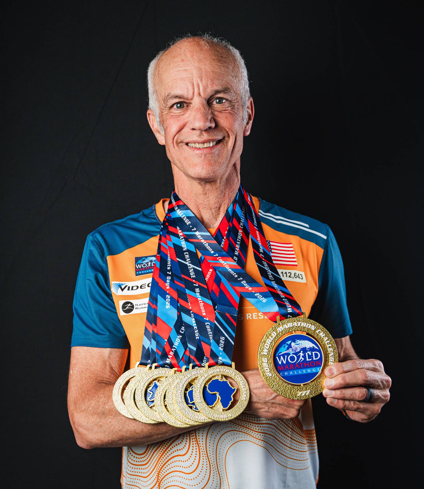 Lincoln Bode shows off his hardware gained from running the World Marathon Challenge at the closing ceremony in Miami on Feb. 6.