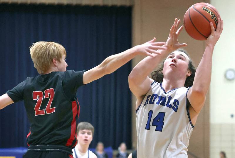 Hinckley-Big Rock's Martin Ledbetter shoots over Indian Creek's Tyler Bogle during their game Tuesday, Jan. 31, 2023, in the Little 10 Conference Basketball Tournament at Somonauk High School.