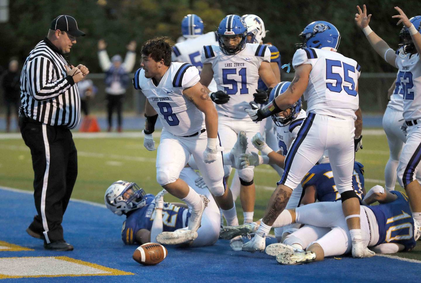 Brian Hill/bhill@dailyherald.com
Lake Zurich's Calen Grabowski (8) emerges from the pack after scoring against Wheaton North during the second round of the IHSA playoffs Saturday November 5, 2022 in Wheaton.