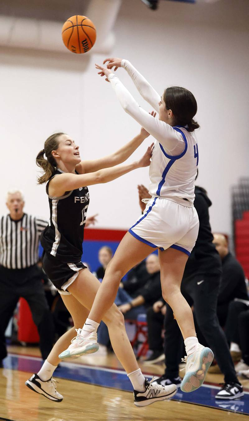St. Charles North's Hannah Ganser (4) passes the ball over Fenwick's Cammie Molis (15) during the Dundee-Crown High School 41st Annual Komaromy Classic Friday, Dec. 27, 2024 in Carpentersville.
