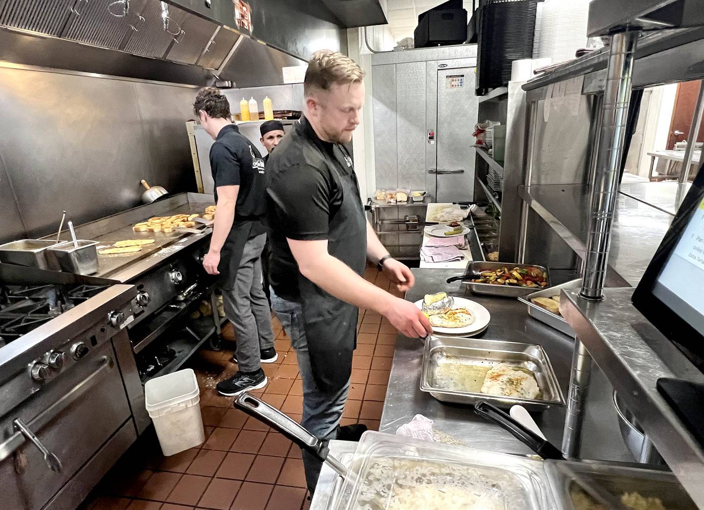Faranda’s general manager Anthony McMahon plates some fish Friday, March 20, 2026, during the annual Lenten season fish fry at Faranda’s Banquets in DeKalb. The fish fries are 4 to 8 p.m. Fridays through April 3 at the banquet center and a portion of the procedes go to support multiple social service agencies in DeKalb County.