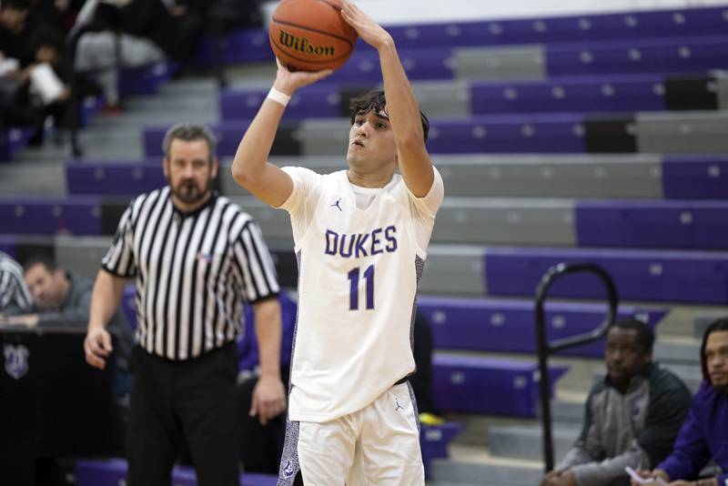 Dixon’s Wyatt Wetzell puts up a three point shot Tuesday, Dec. 13, 2022 against Plano.