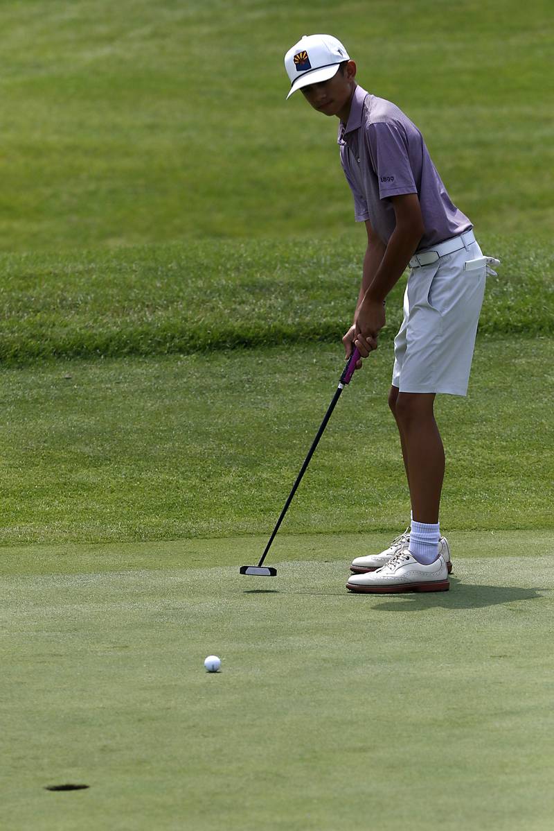 Orion Carlson watches his putt on the fourth green during the final round of McHenry County Junior Amateur Golf Tournament  on Tuesday, July 18, 2025, at Foxford Hills Golf Club in Cary.