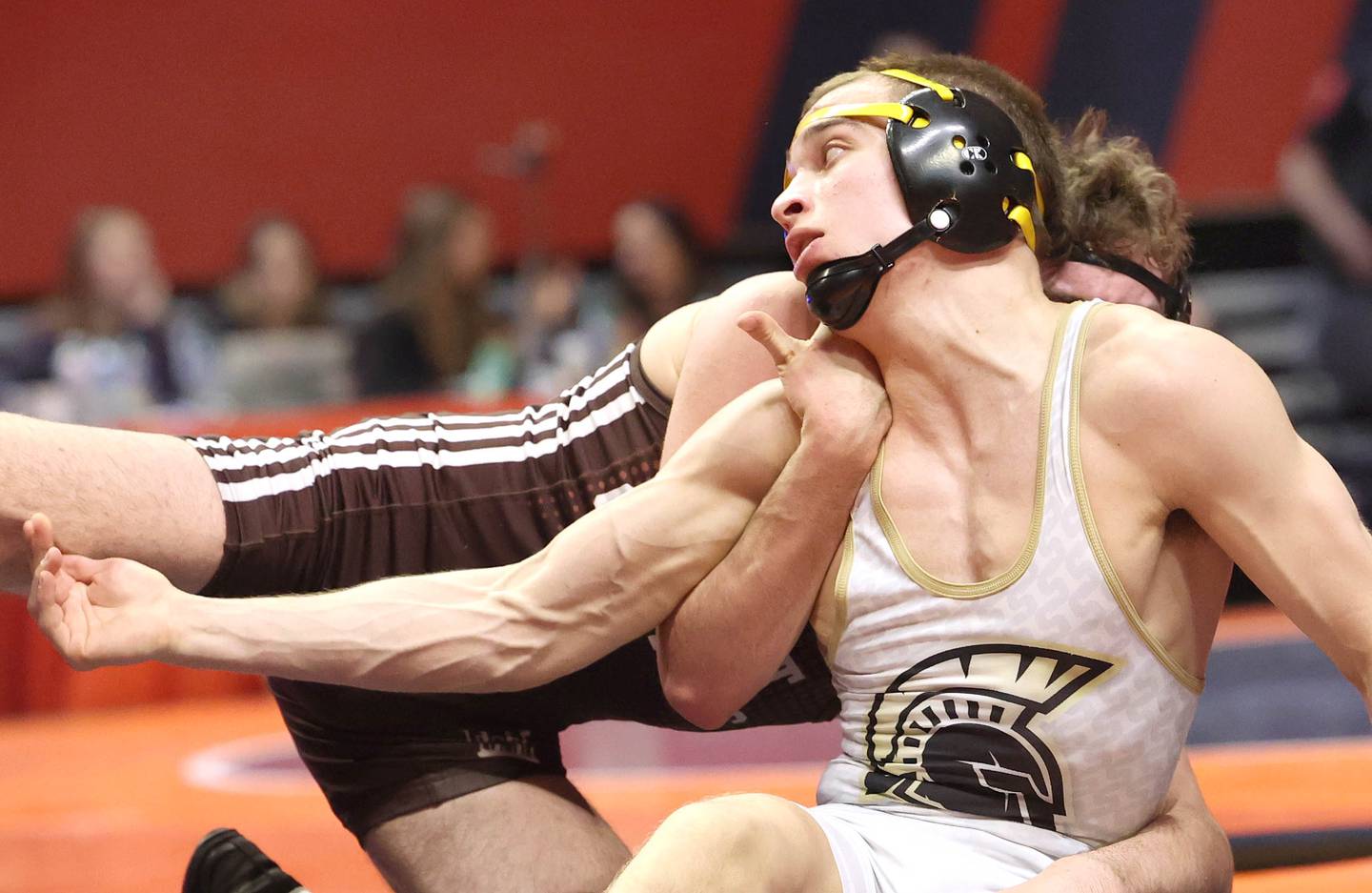 Sycamore’s Gus Cambier (front) wrestles Joliet Catholic’s Connor Cumbee Saturday, Feb. 18, 2023, in the Class 2A 152 pound 3rd place match in the IHSA individual state wrestling finals in the State Farm Center at the University of Illinois in Champaign.