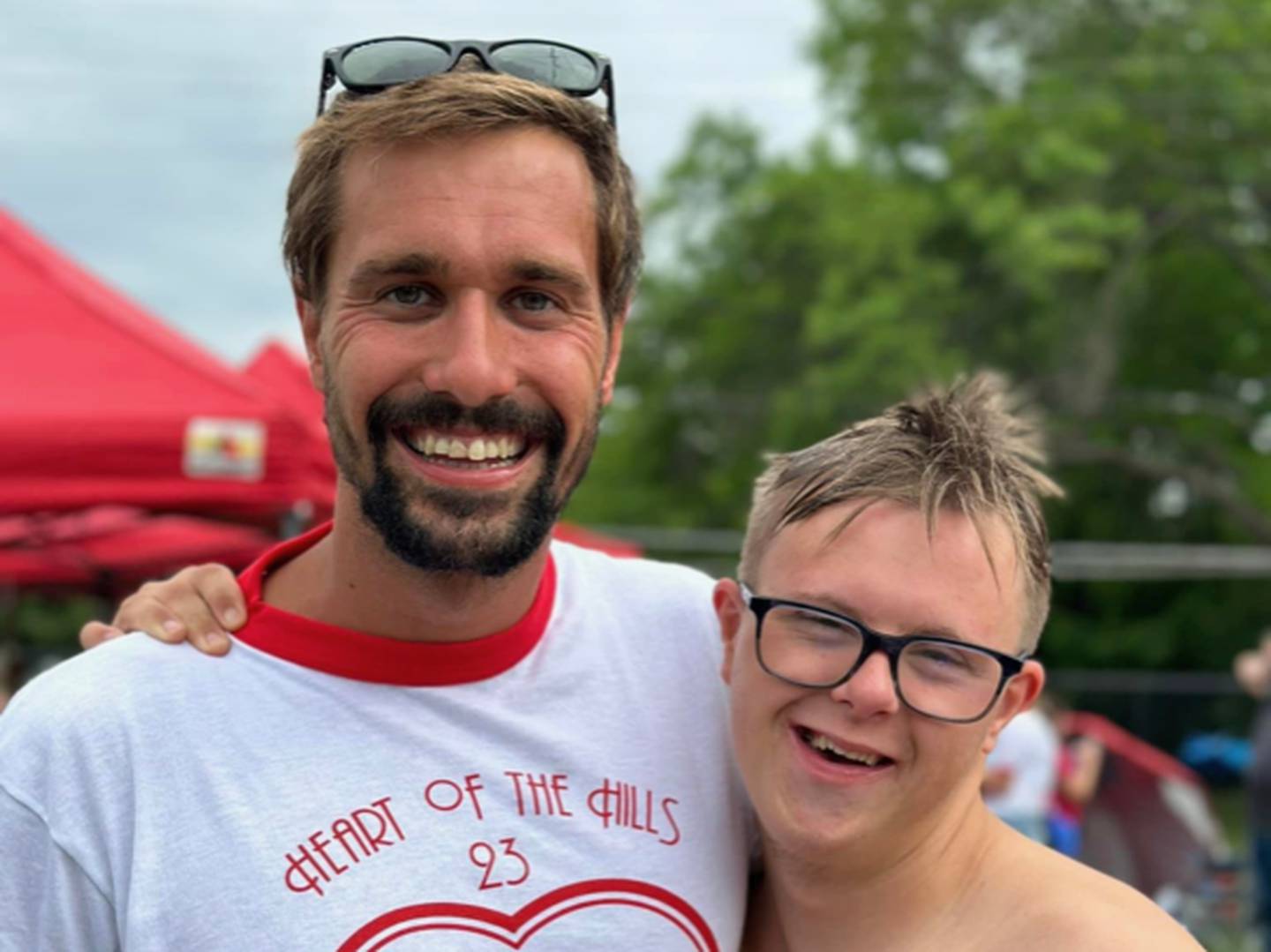 Aaron Helander (left) poses for a picture with former Rochester High School swimmer Tim MacLean (right), a four-time Michigan High School Athletic Association Division 1 State Finals qualifier.