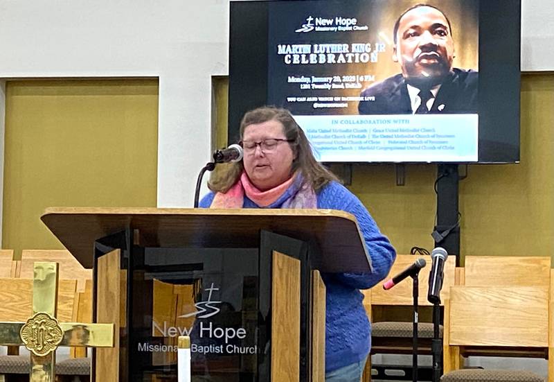 Pastor Lauri Allen of Mayfield Congregational United Church of Christ, reads excerpts from "The Other America," a speech given by the Rev. Martin Luther King, Jr., on April 14, 1967, at Standford University. Allen's recitation was part of an annual MLK Day celebration held on Monday, Jan. 20, 2025, at New Hope Missionary Baptist Church, 1201 Twombly Road, DeKalb.
