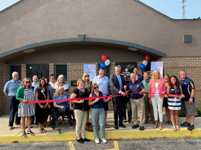 The Grundy County Chamber of Commerce helps State Senator Tom Bennett (R-Gibson City) and Congressman Darin LaHood (R-Dunlap) cut the ribbon on their new office in Morris.