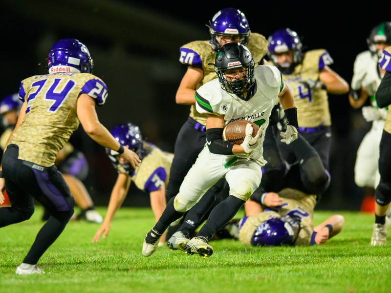 Rock Falls' Korbin Oligney finds his way through the Dixon defense to pick extra yardage at Rock Falls on Friday, Sept. 8, 2023.