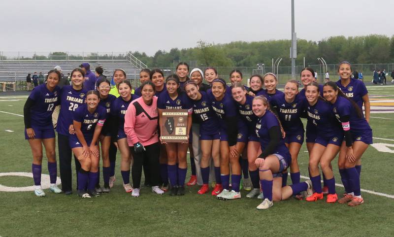 Members of the Mendota girls soccer team pose with the  Class 1A Regional final plaque after defeating Princeton on Tuesday, May 20, 2025 at Mendota High School.