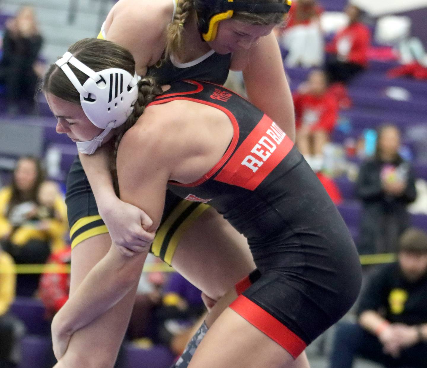 Huntley’s Aubrie Rohrbacher strikes against Harvard’s Khloe Vest at 130 pounds in IHSA Regional wrestling semifinal action on Saturday, Feb. 1, 2025, at  Hampshire High School  in Hampshire.