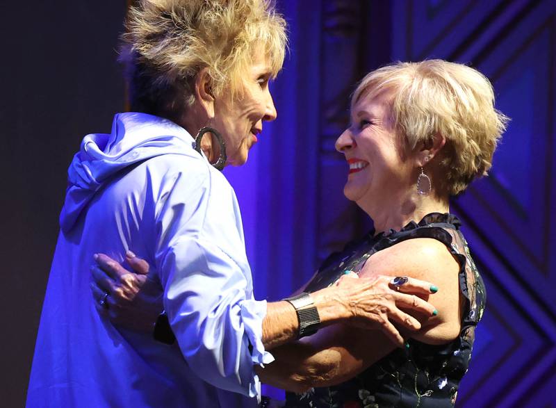 Celine Bennetts (right) gets a hug from her presenter Jeanie Martin as she is announced as an Athena Award finalist Thursday, Oct. 10, 2024, during the Athena and Women of Accomplishment Awards reception hosted by the DeKalb Chamber of Commerce at the Egyptian Theatre.