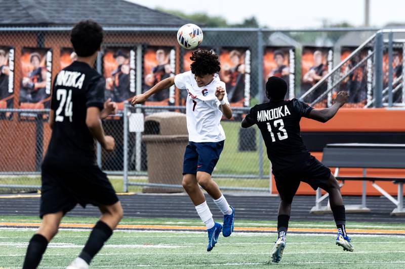 Romeoville's Santiago Beleno goes for a header during a varsity soccer away game against Minooka on Sept. 23, 2025.