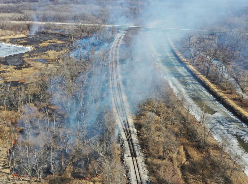 A large brush fire burns where Interstate 180 intersects with the Hennepin Canal on Tuesday, Feb. 10, 2026 near Princeton. A Mutual Aid Box Alarm (MABAS) was dispatched around 12:30p.m. Bureau County Fire departments from Bureau, Ladd, Wyanet, Princeton, Hennepin and others assisted with the brush fire.